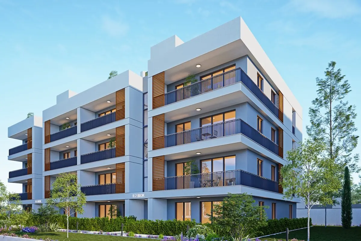 Modern low-rise residential building exterior with contemporary architecture and green landscaping for sale in the Büyükçekmece district, Istanbul.