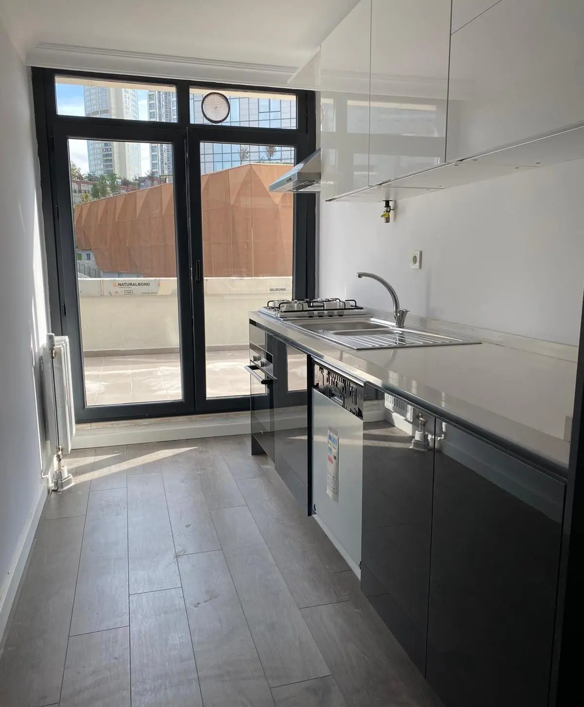 Modern apartment kitchen with sleek cabinetry and contemporary interior design for sale in the Bomonti district, Şişli.