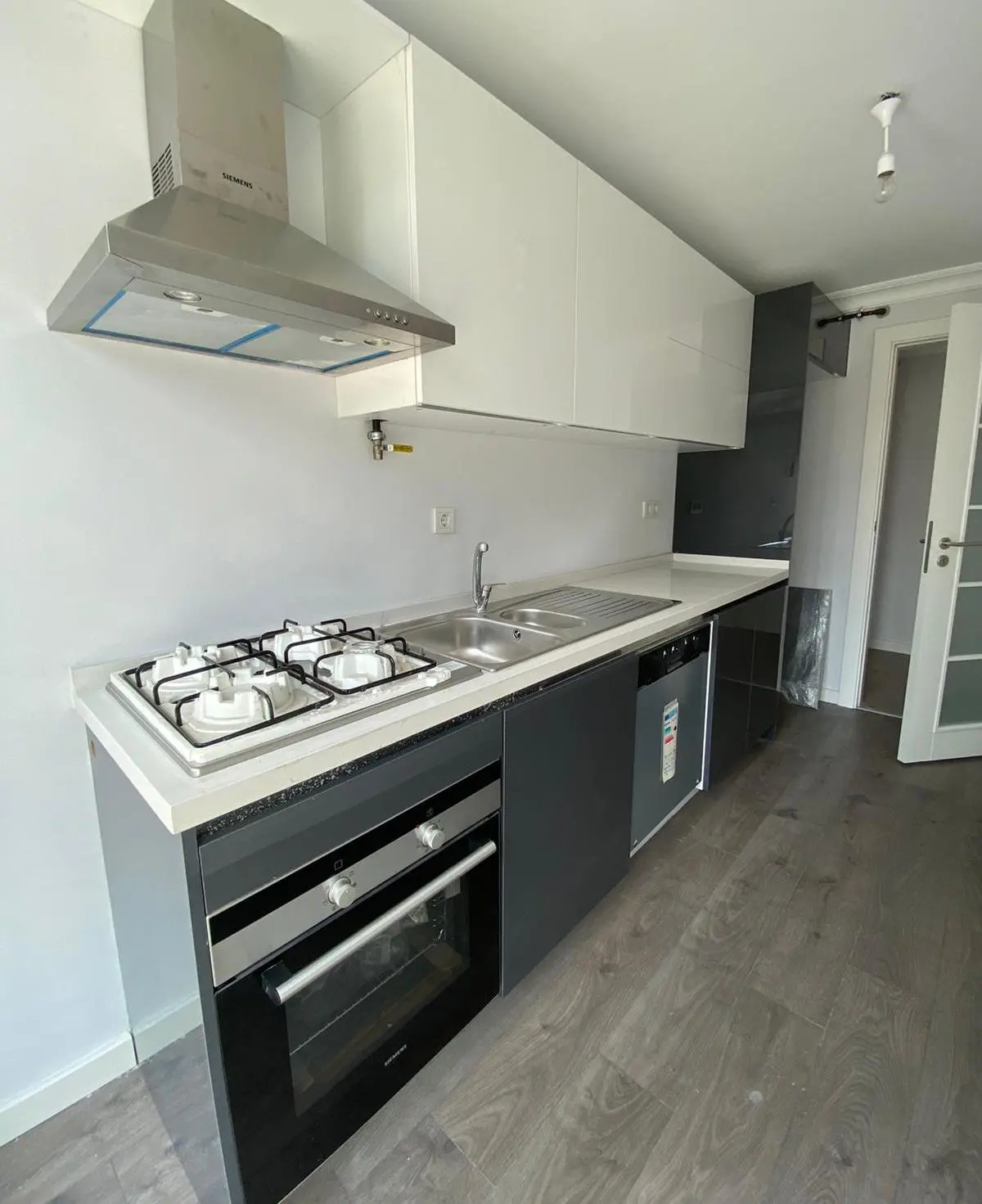 Luxury kitchen interior with high-end appliances, modern cabinetry, and elegant finishes in a Bomonti apartment, Istanbul.