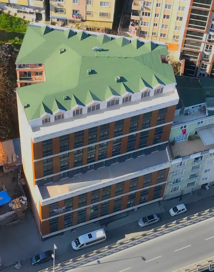 Modern and sleek high-rise residential building exterior with contemporary architectural design in the Bomonti district, Istanbul.