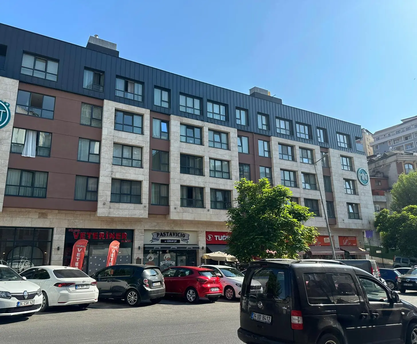 Modern residential building exterior with a sleek facade and contemporary architectural design in the Şişli district, Istanbul.