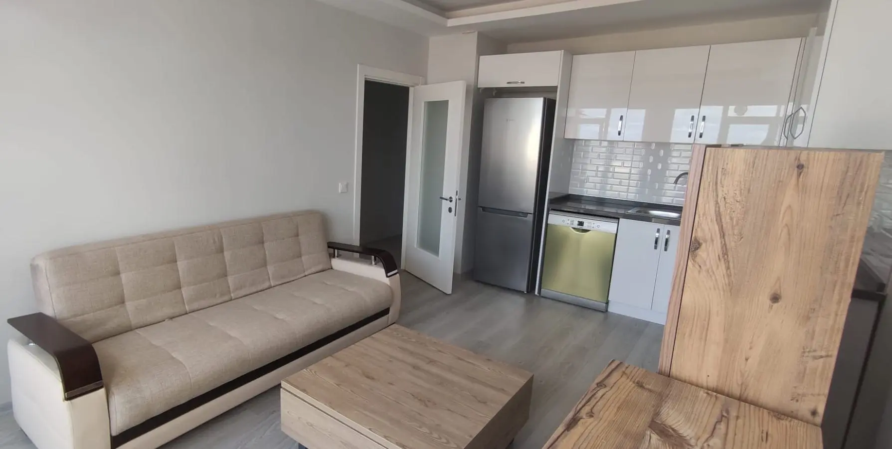 Interior view of a modern and bright apartment for sale with contemporary finishes in the Kurtuluş district, Istanbul.