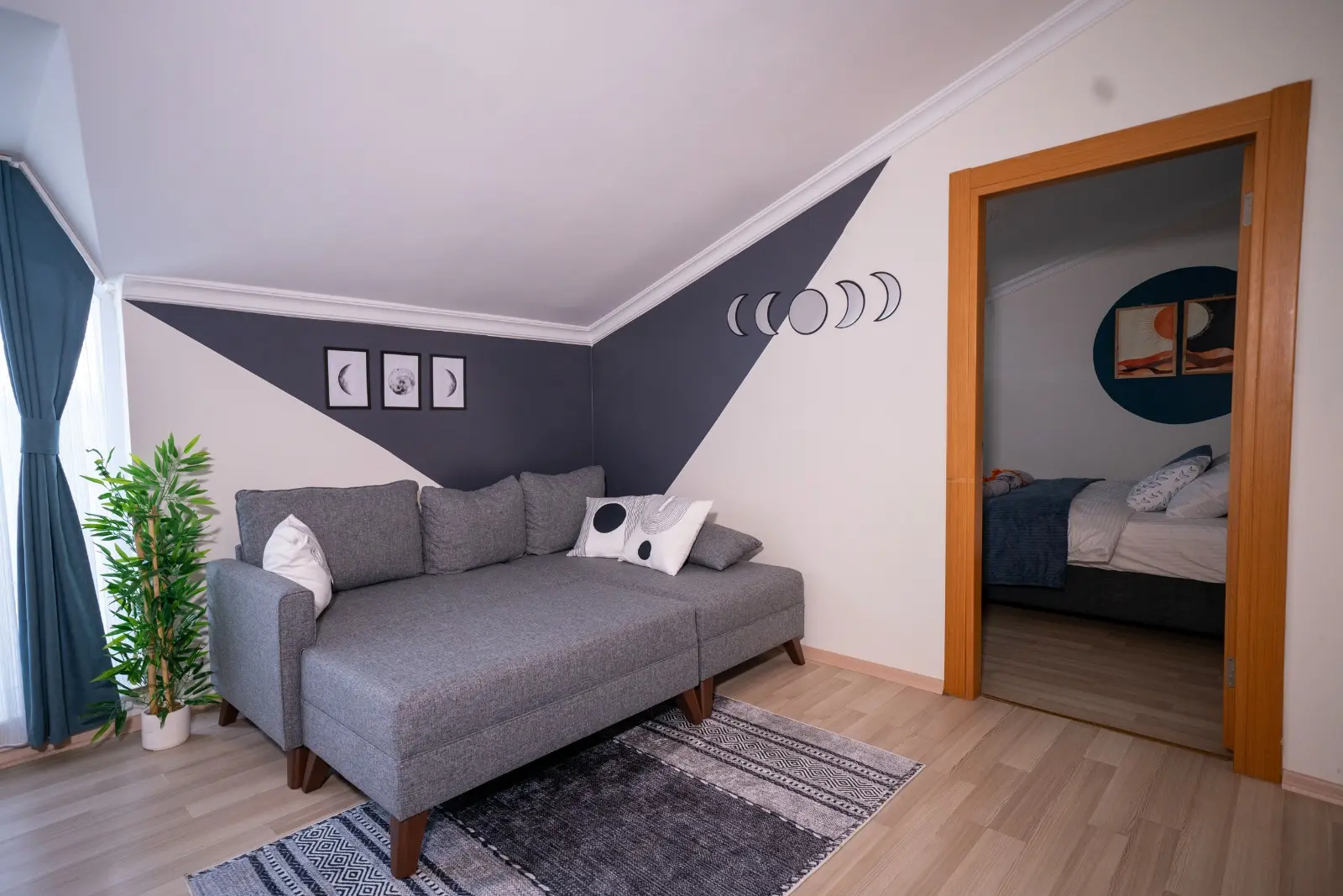 Bright and airy modern living room with large windows and contemporary interior design in a Beyoğlu apartment, Istanbul.