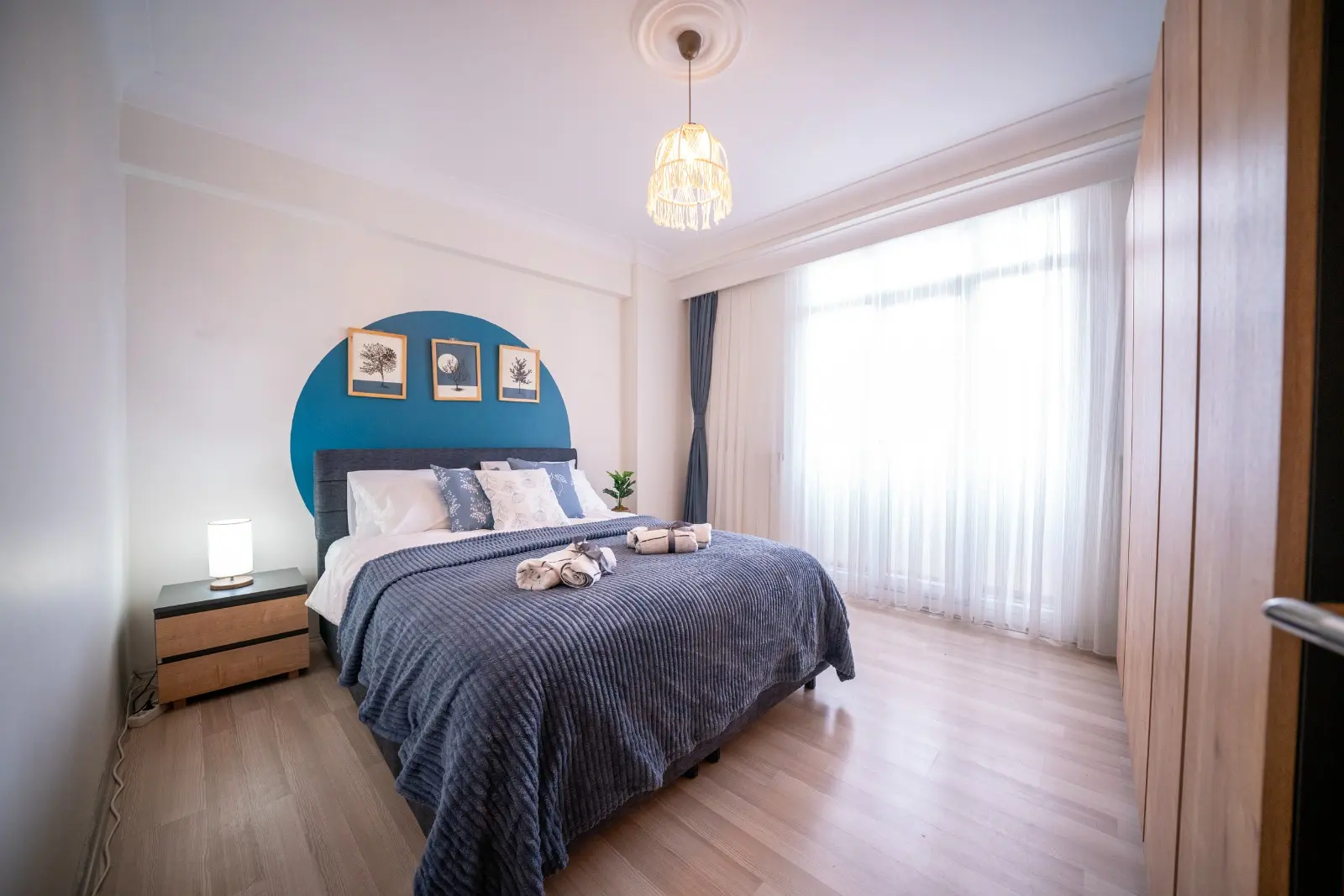 Modern bedroom design with contemporary furniture and elegant interior finishes in a Beyoğlu apartment, Istanbul.
