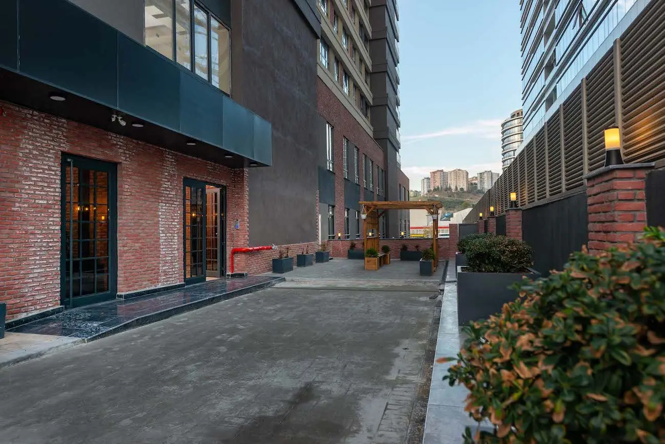 Beautifully landscaped garden and outdoor seating area within a residential complex in Kağıthane, Istanbul.
