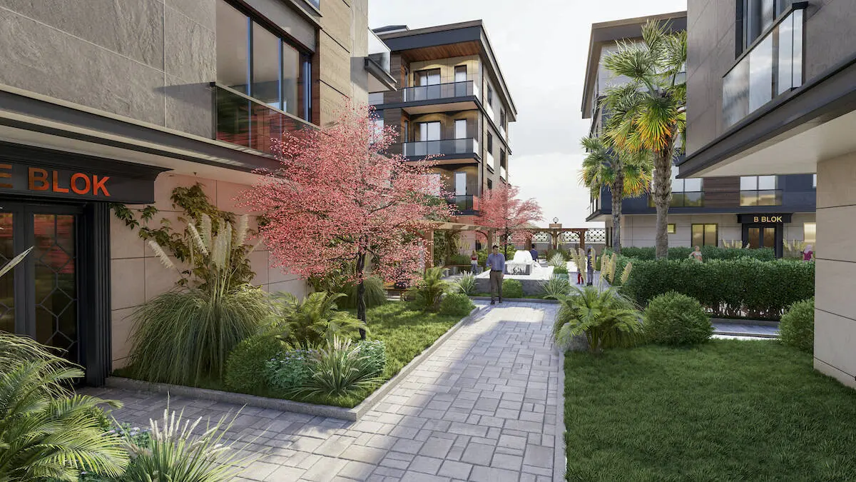 Modern outdoor walking path and landscaped green area within a residential complex in Beylikdüzü, Istanbul.